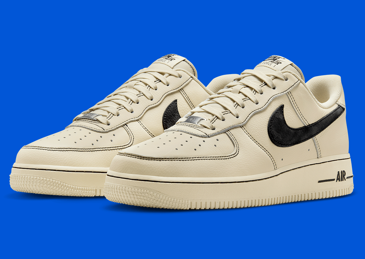 Close-up profile of the Nike Air Force 1 Low "Light Khaki/Black" highlighting the premium leather and detailed stitching.