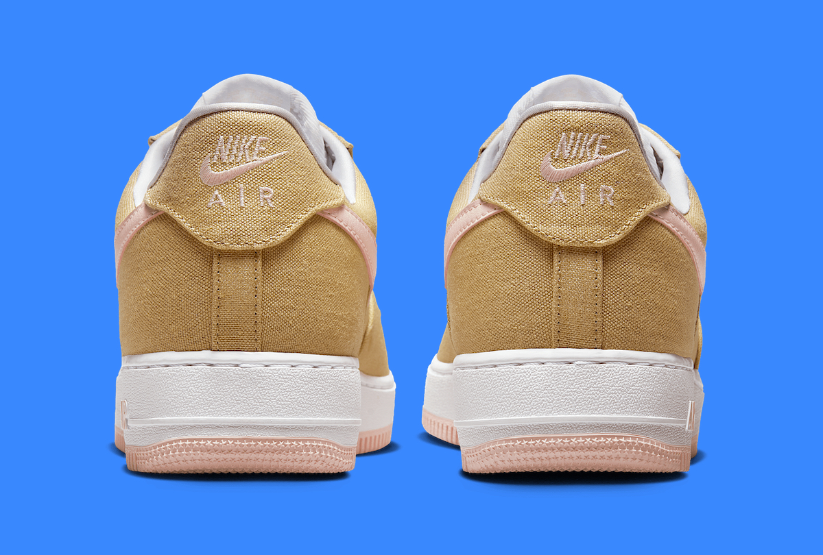 Back view of the Nike Air Force 1 Low 'Linen/Linen' displaying embroidered Nike Air branding on the heel tab, soft textile collar, and tan canvas construction.