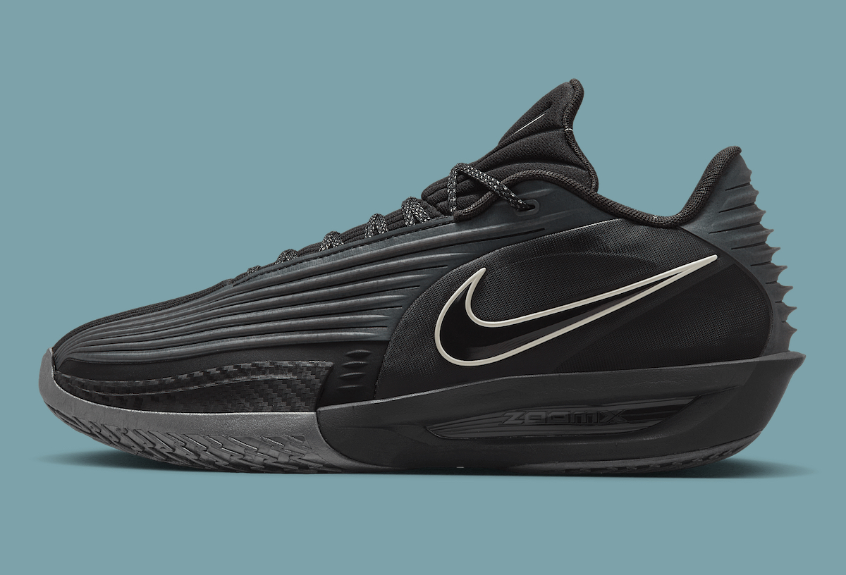 Side profile of the Nike GT Cut 3 Turbo Black Label sneaker showcasing its black colorway and dynamic design elements, including the iconic Nike Swoosh.