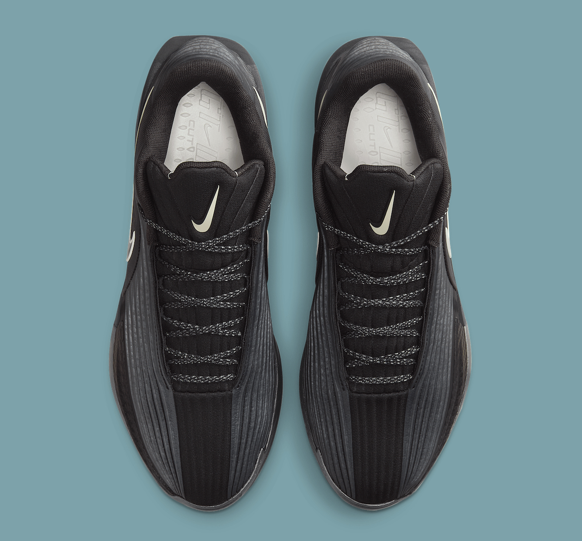 Top-down view of the Nike GT Cut 3 Turbo Black Label, emphasizing the smooth texture and black lacing system of the sneaker.