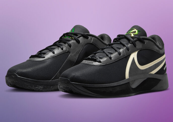 Nike Giannis Freak 6 Black Label basketball sneakers in black with cream Swoosh and neon green details.