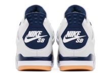 The back of the Nike SB x Air Jordan 4 showcases the bold 'Nike SB' logo in white against a navy heel tab, staying true to its skateboarding influence.