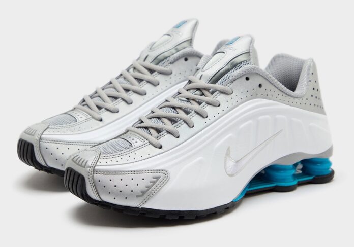 Nike Shox R4 Blue Lagoon side profile showcasing metallic silver overlays and blue Shox pillars