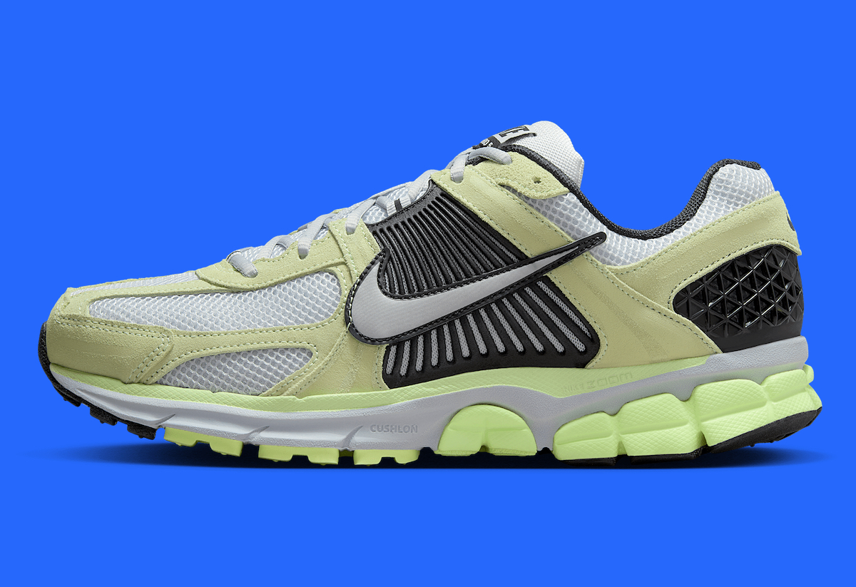 Side view of Nike Zoom Vomero 5 Barely Volt highlighting the grey profile cage and Swoosh logo.