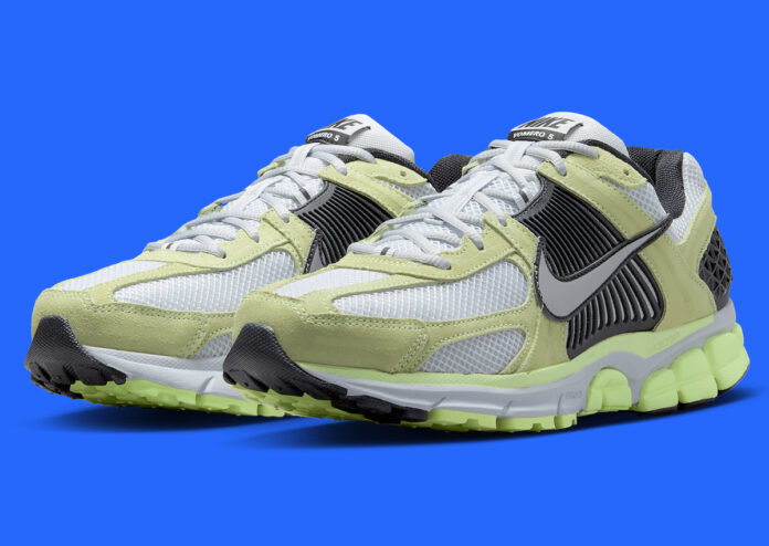 Nike Zoom Vomero 5 Barely Volt showcasing its off-white mesh and green suede overlays.