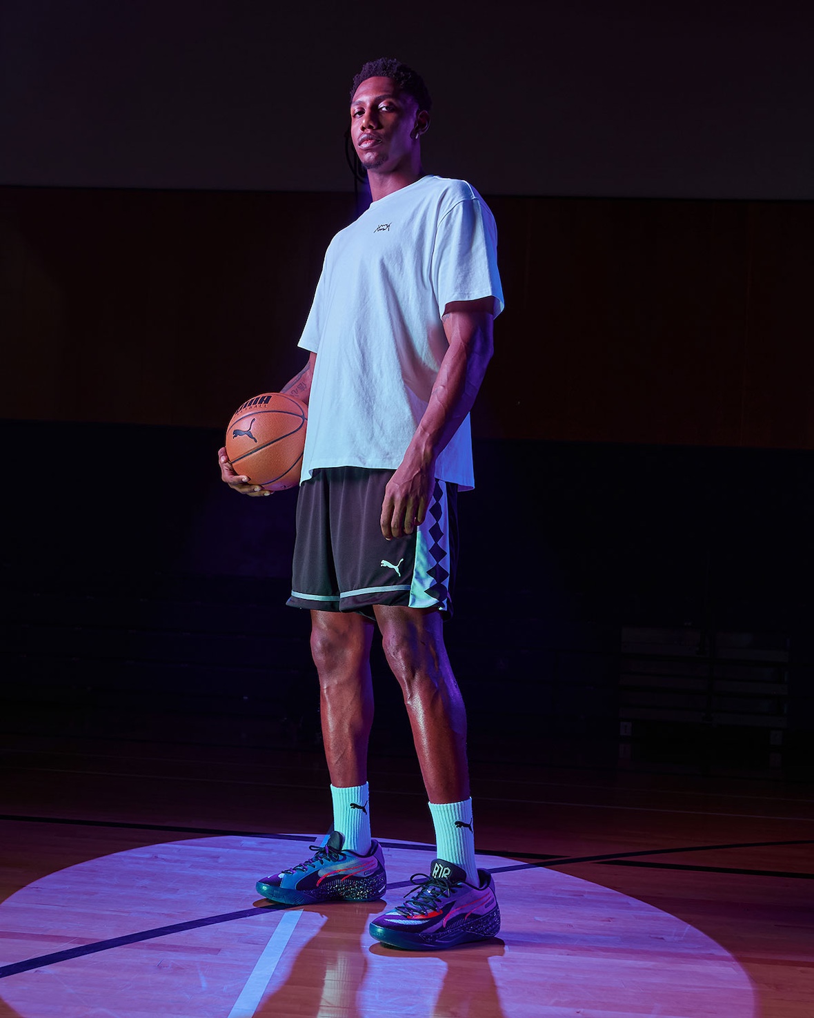 RJ Barrett wearing PUMA All-Pro Nitro PE while holding a basketball on court