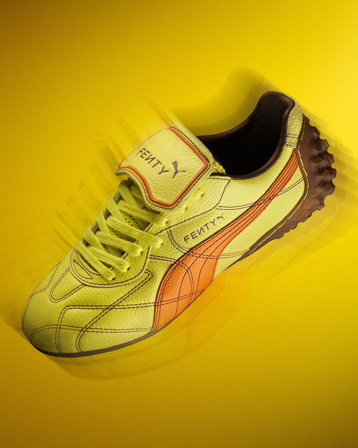 FENTY x PUMA Avanti LS in neon yellow with orange Formstrip against a vibrant yellow background