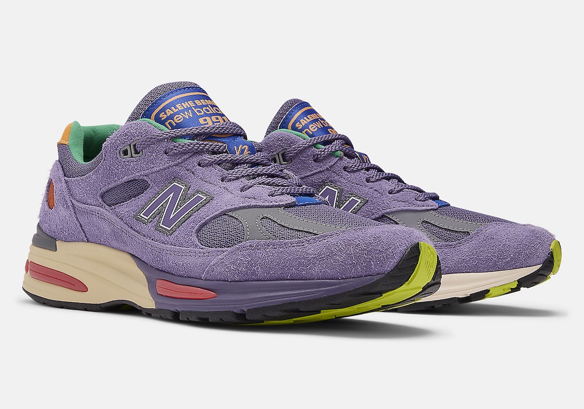 A detailed look at the Salehe Bembury x New Balance 991v2 'Colors Be The Palette' featuring a premium purple suede upper, mesh paneling, and vibrant color accents.