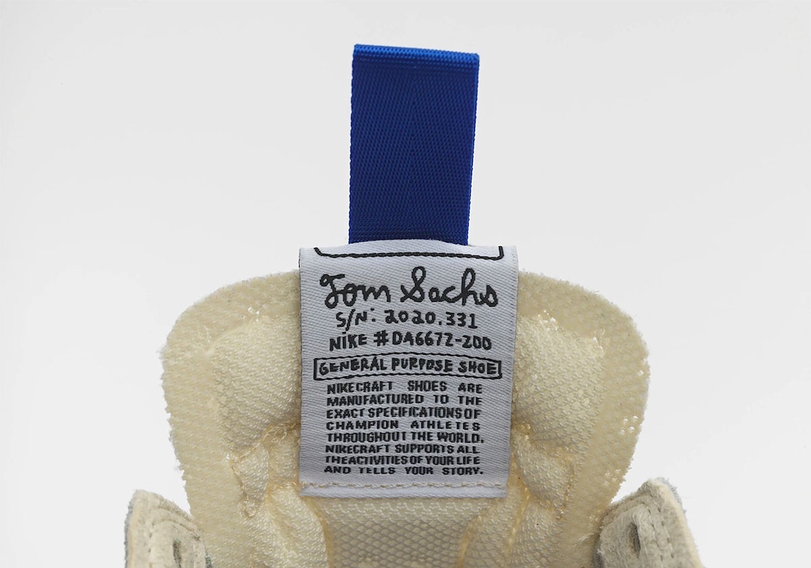 Close-up of blue heel tab on Tom Sachs x Nike General Purpose Shoe 2025 restock.