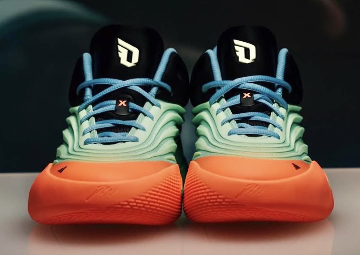Front view of the adidas Dame 10 Dame’s Light showcasing the bold colorway and reinforced upper.