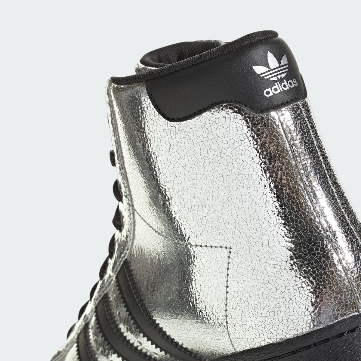 Close-up of the black shell toe and wheels on the adidas Superstar 82 Roller Skates