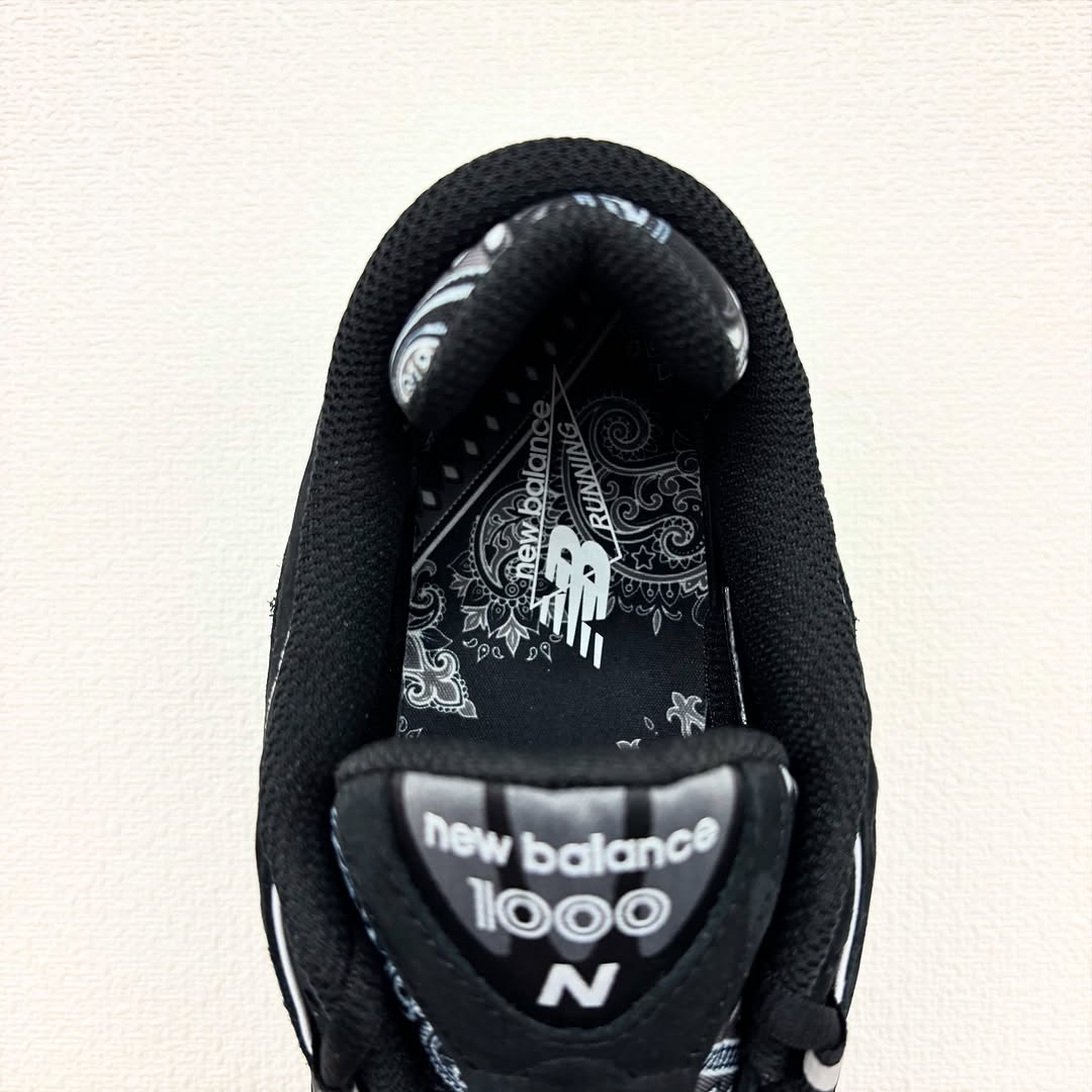 Close-up of the atmos x New Balance 1000 showcasing the paisley print and insole branding