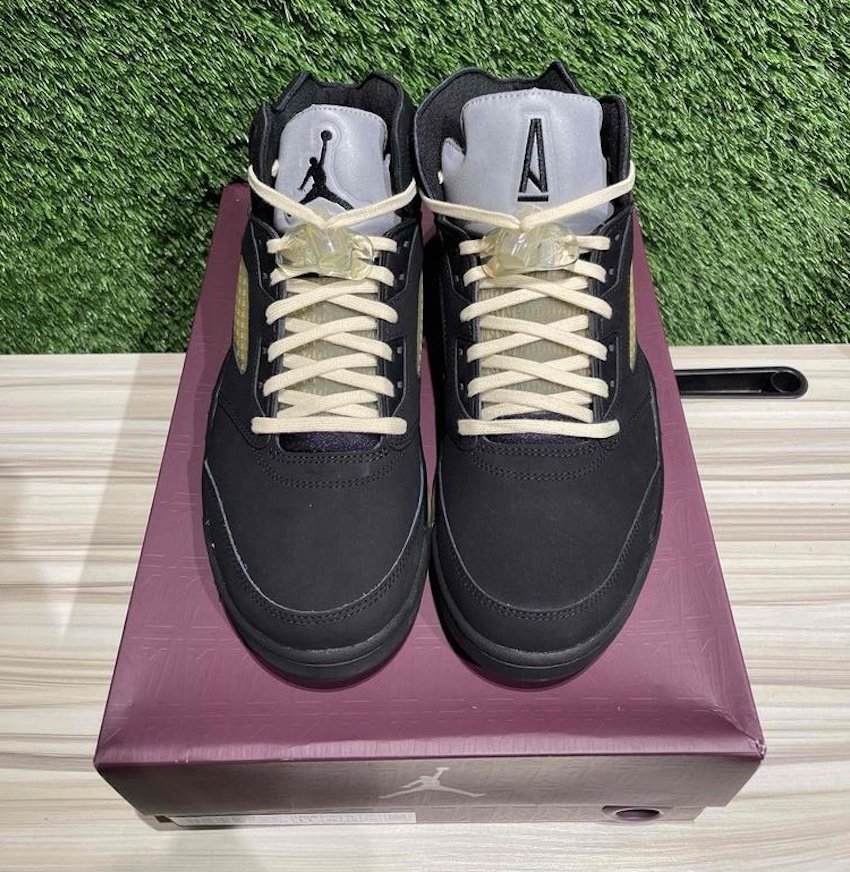 Top-down view of A Ma Maniére x Air Jordan 5 "Dusk" on its premium packaging