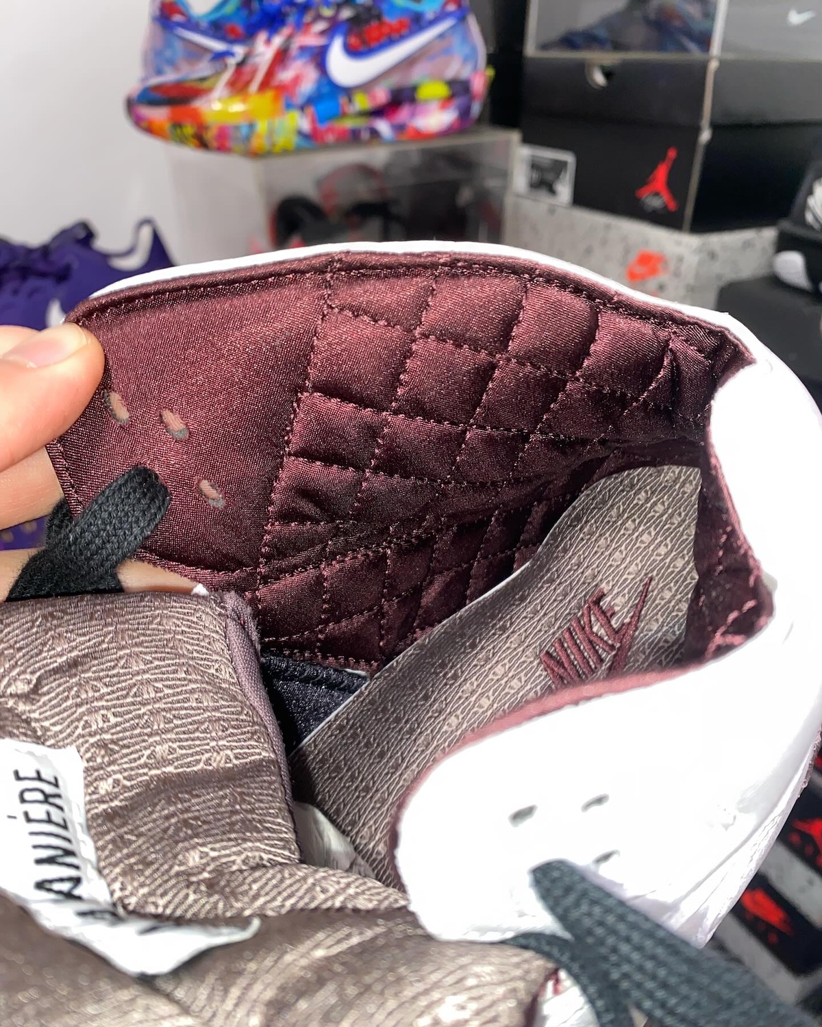 Quilted inner lining and monogrammed details of the A Ma Maniere Jordan 5.