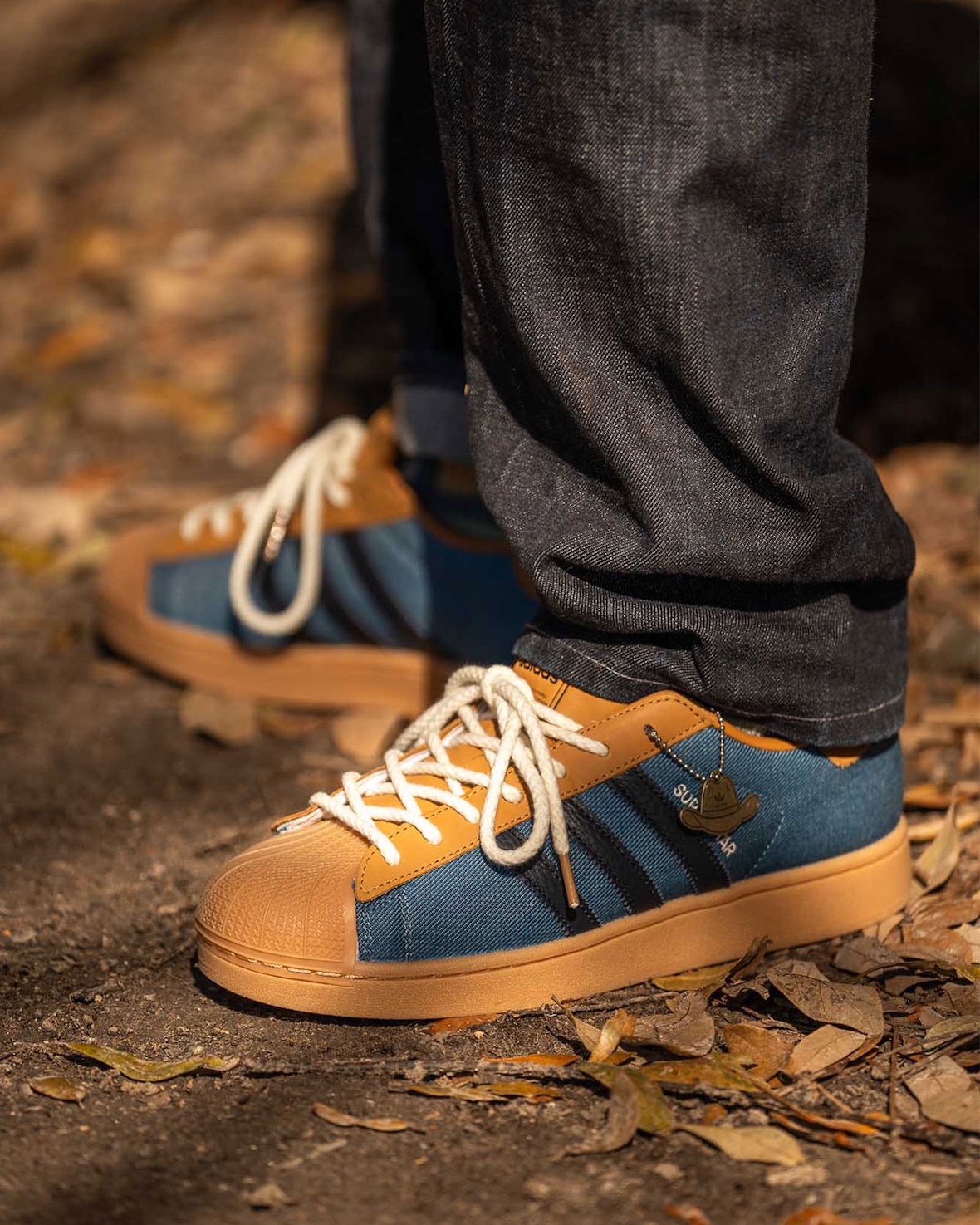 adidas Superstar II "Everyone's Invited" on-feet shot in an outdoor setting.