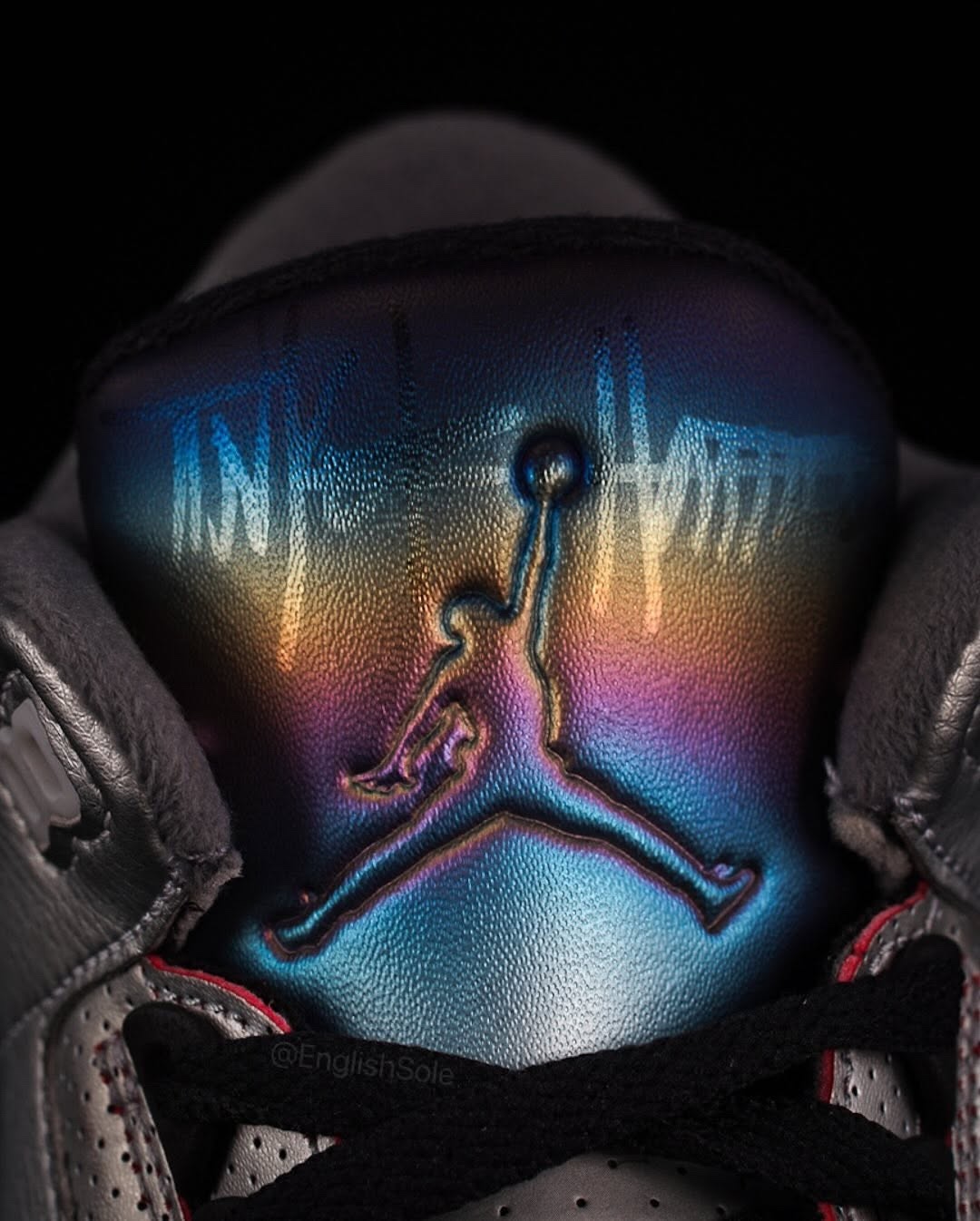 Macro shot of the holographic Jumpman logo on the Air Jordan 3 RTNA