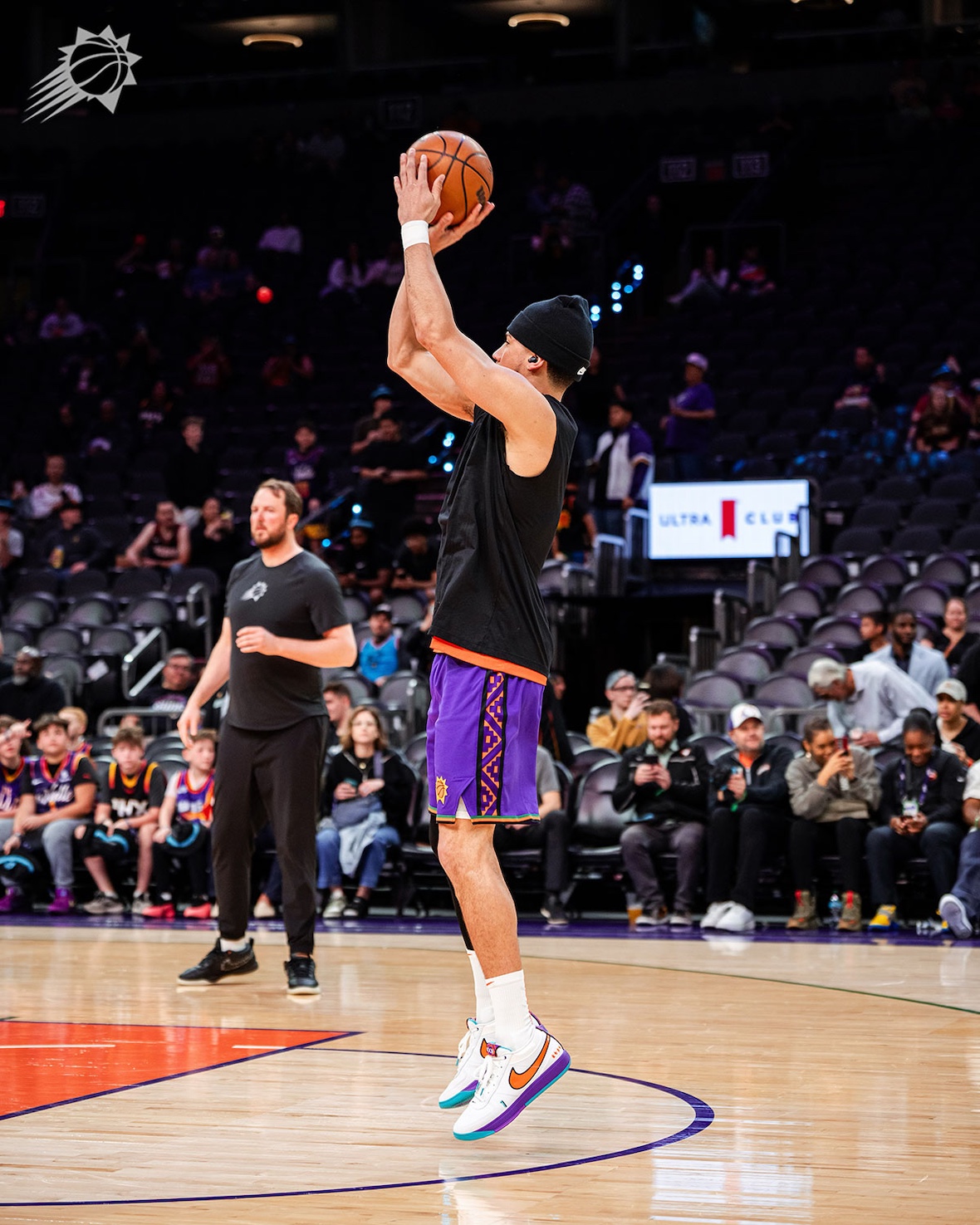 Devin Booker taking a jump shot while wearing the Nike Book 1 "1995 All-Star" PE.