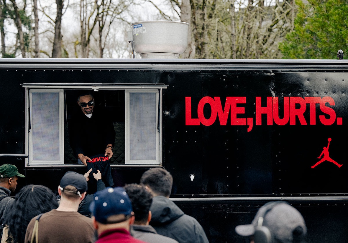 A custom food truck labeled "Love, Hurts" distributing exclusive merchandise at Nike HQ.