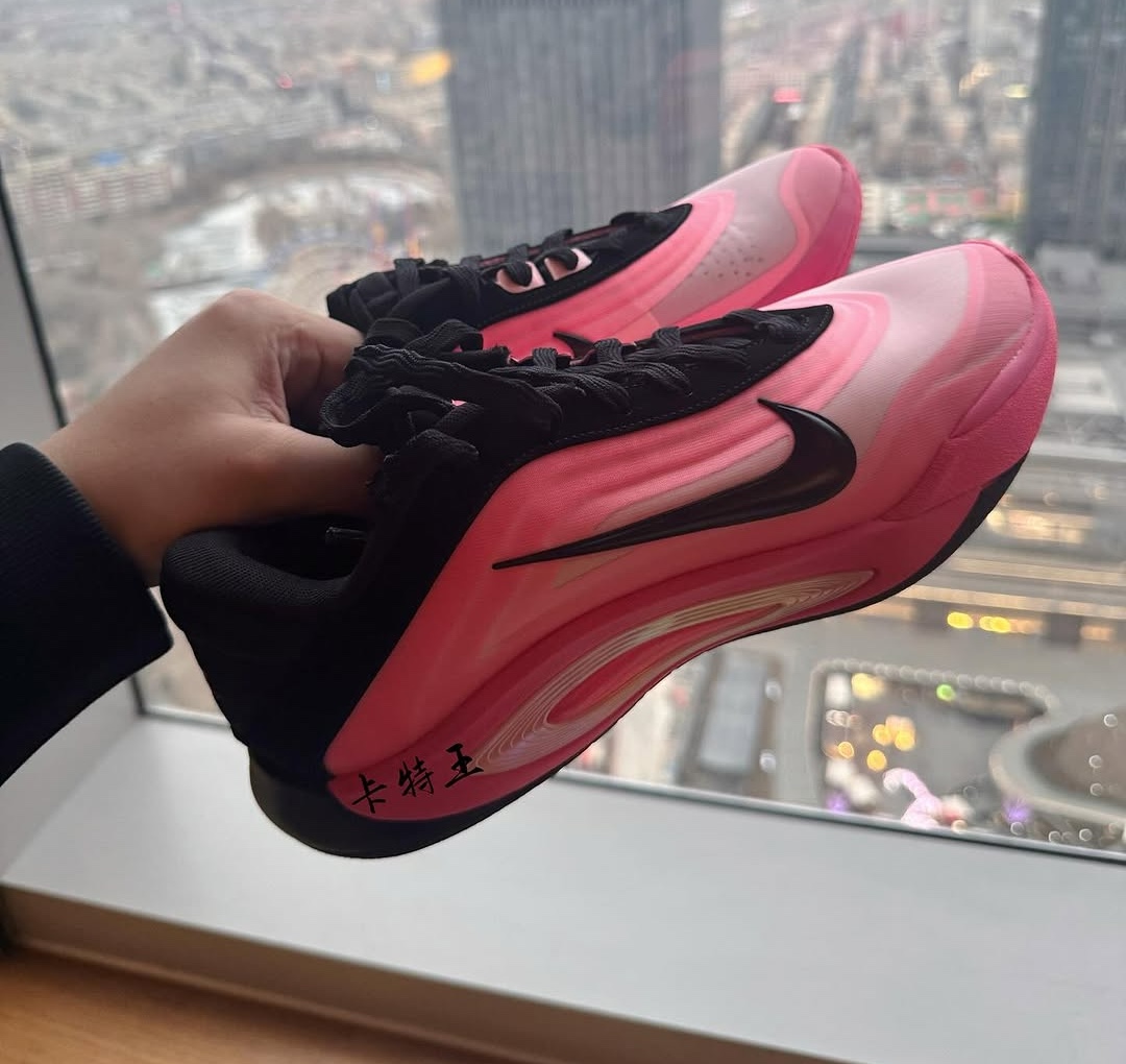 Nike A'One 'Black/Pink' FZ8605-001, A'ja Wilson's signature basketball shoe, featuring a gradient pink upper, black overlays, sculpted midsole, and sleek Swoosh branding.