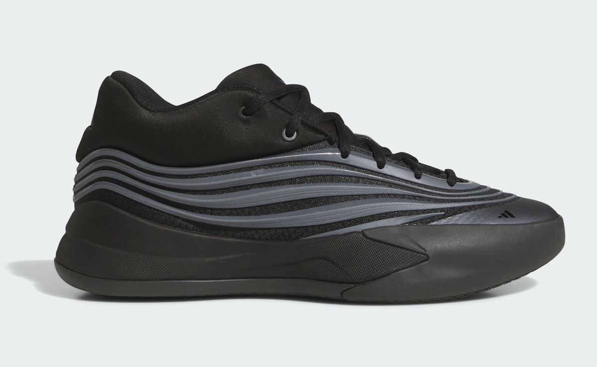 Side profile of the adidas Dame 10 "Core Black" showcasing wavy Iron Metallic stripes.