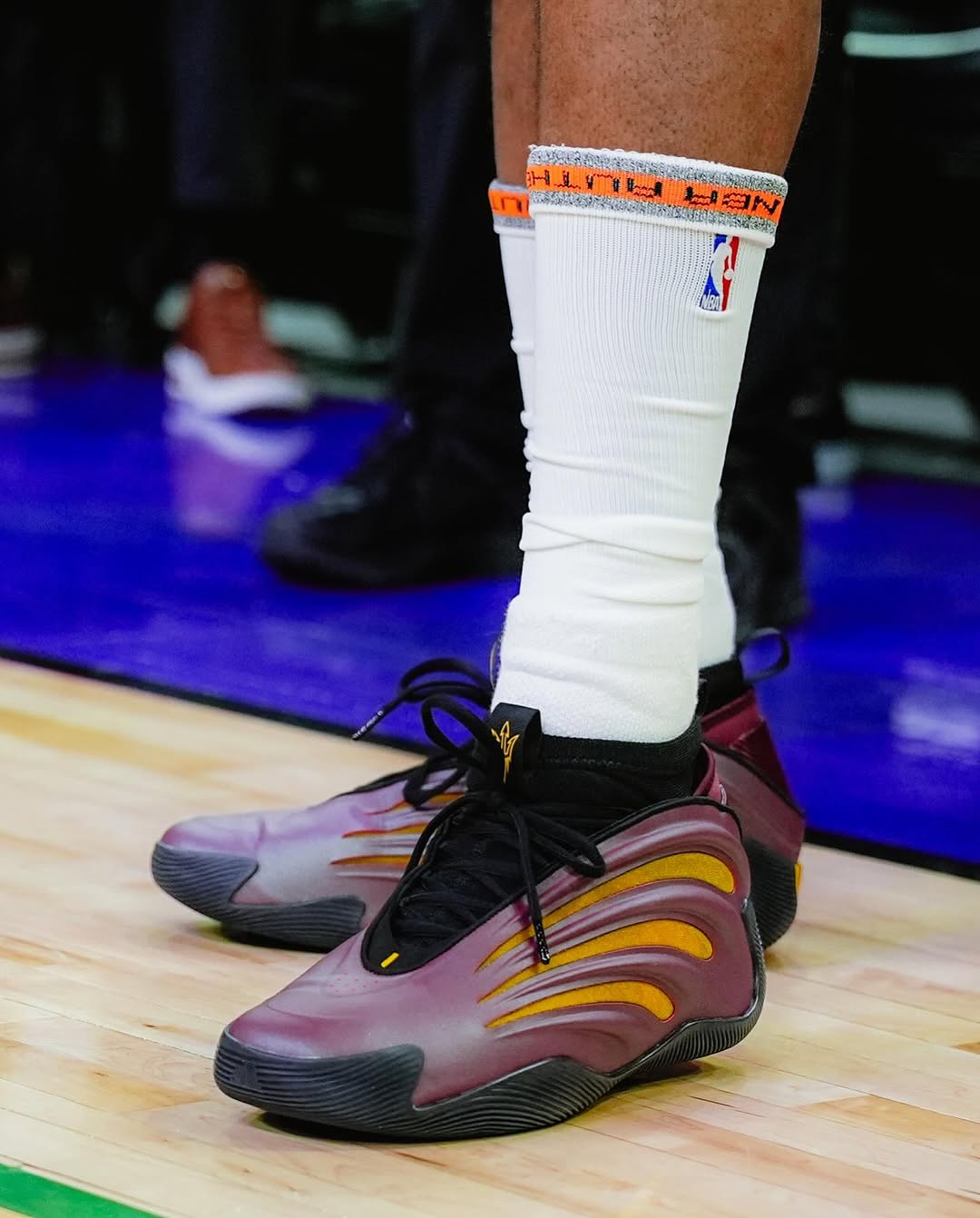 Close-up of Adidas Harden Vol. 9 Sun Devils PE showing gold and maroon details