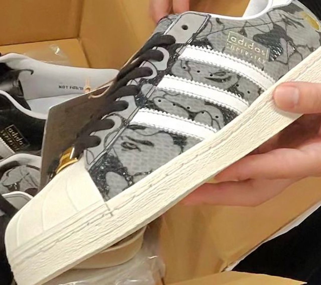 atmos x BAPE x adidas Superstar 25th Anniversary sneaker featuring a greyscale ABC Camo upper with white Three Stripes and gold branding.