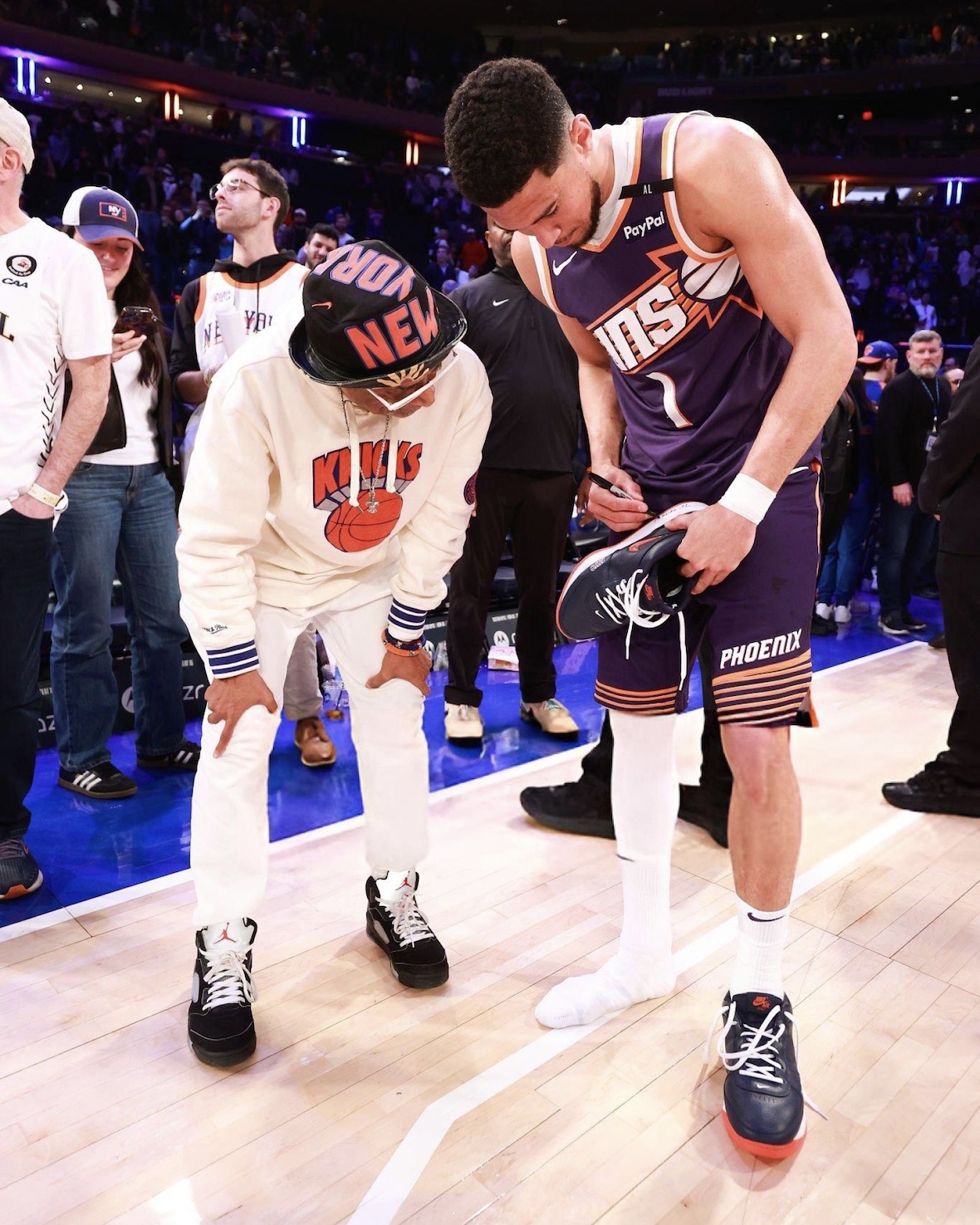 Booker signing his Book 1 NYC Jewel PE on court