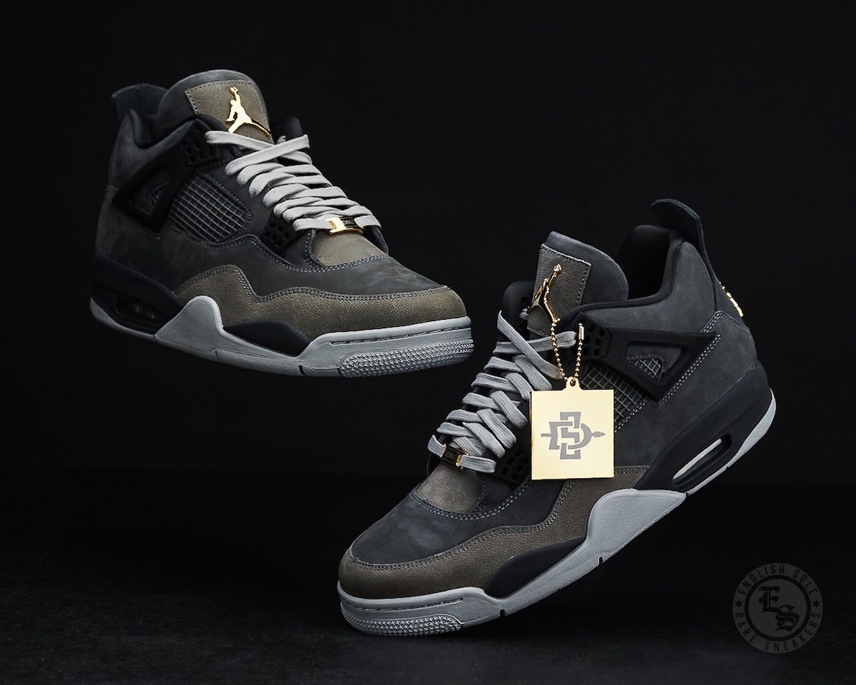San Diego State University Air Jordan 4 PE 2025 in black and grey suede with gold accents and SDSU branding, displayed on a black background.