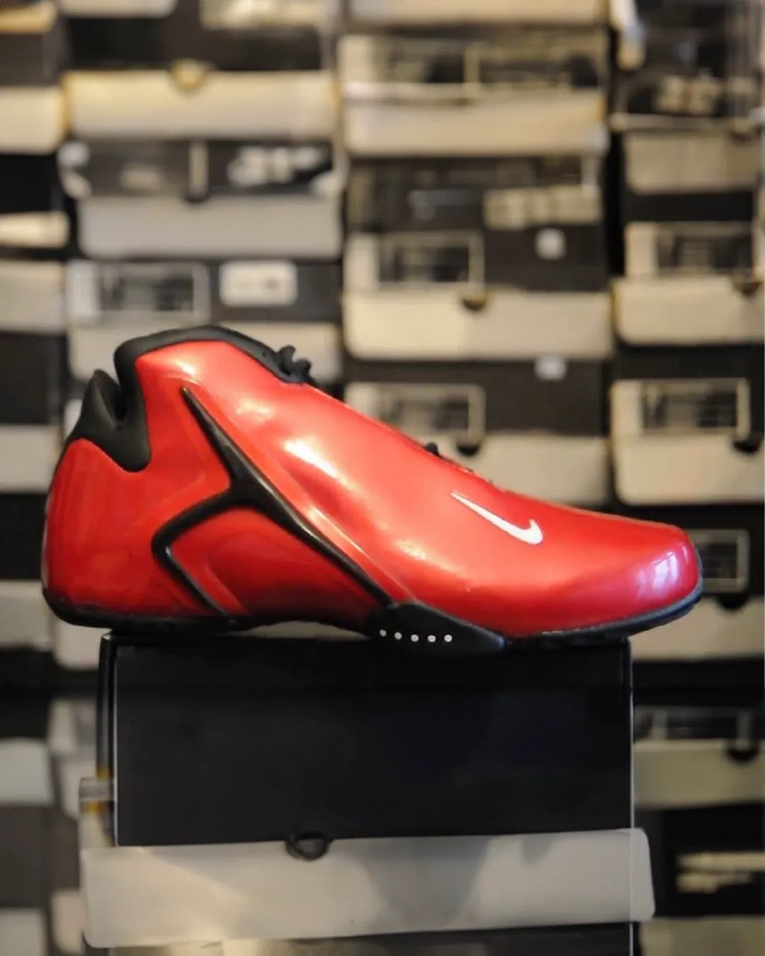 Nike Air Hyperflight Varsity Red 2001 basketball sneaker with glossy red upper and black detailing on display box.