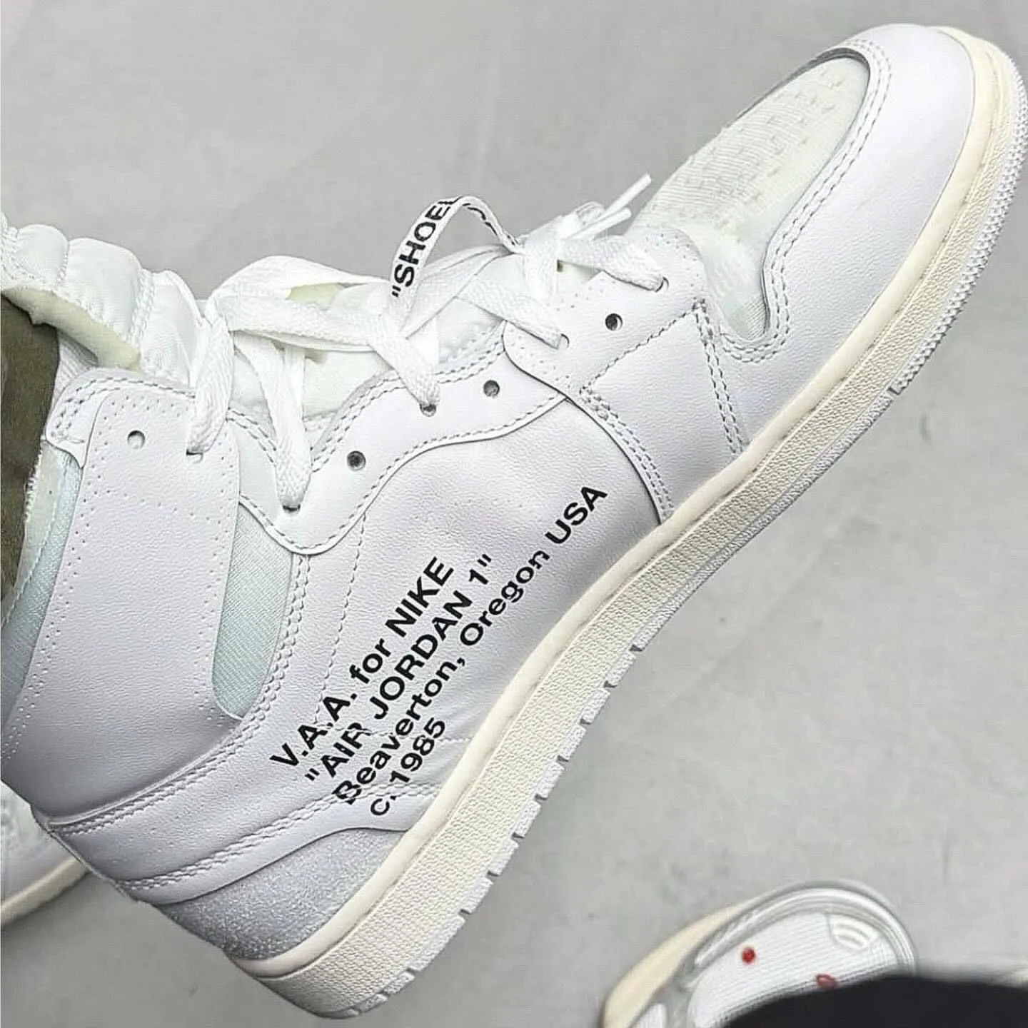Virgil Abloh x Air Jordan 1 High OG White 2026 detailed look with V.A.A. for Nike branding.