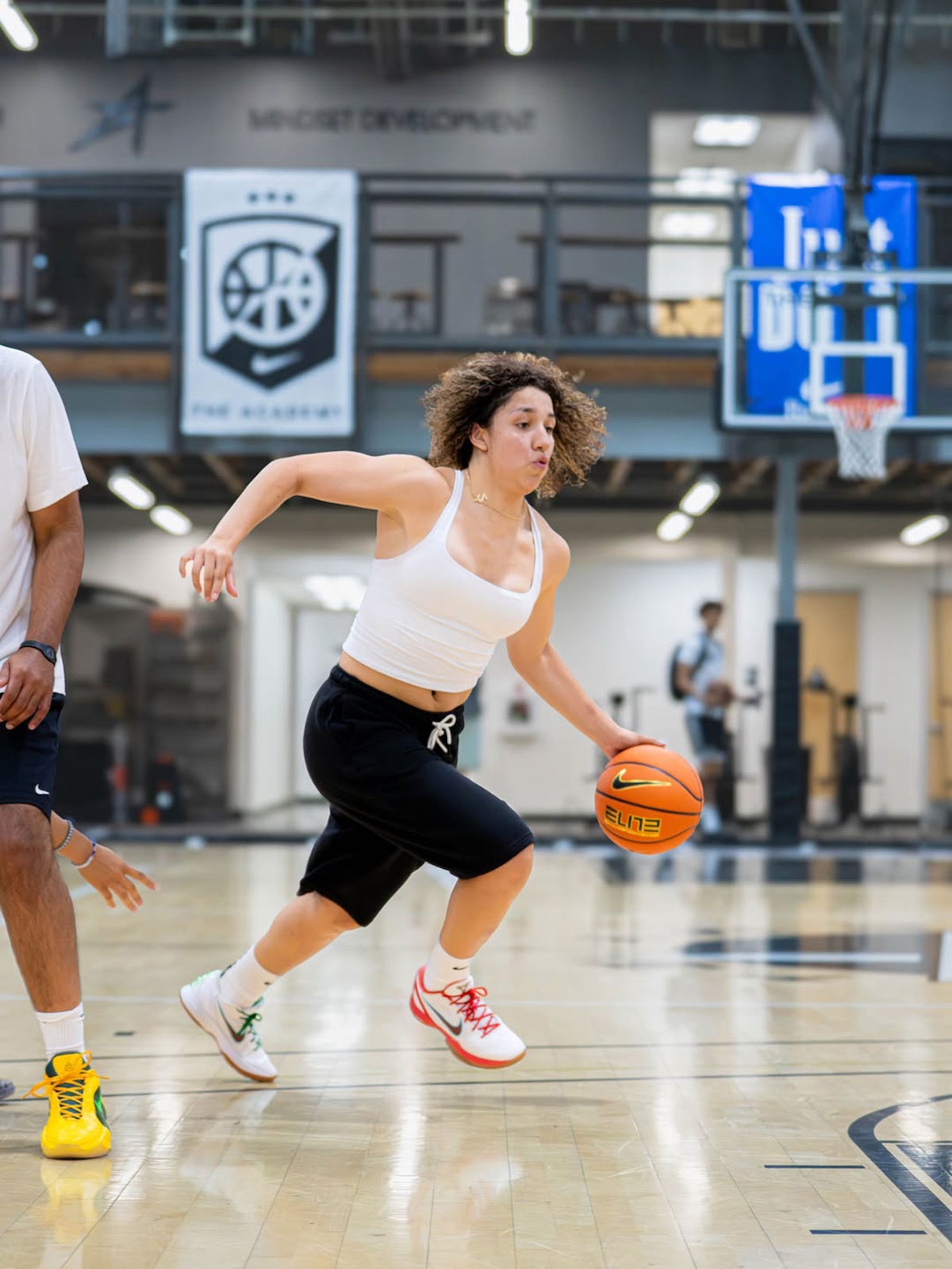 Aaliyah Chavez wearing exclusive Nike Kobe 6 Protro Mexico PE with red, white, and green gradient colorway during preseason warm-ups - detail view 4