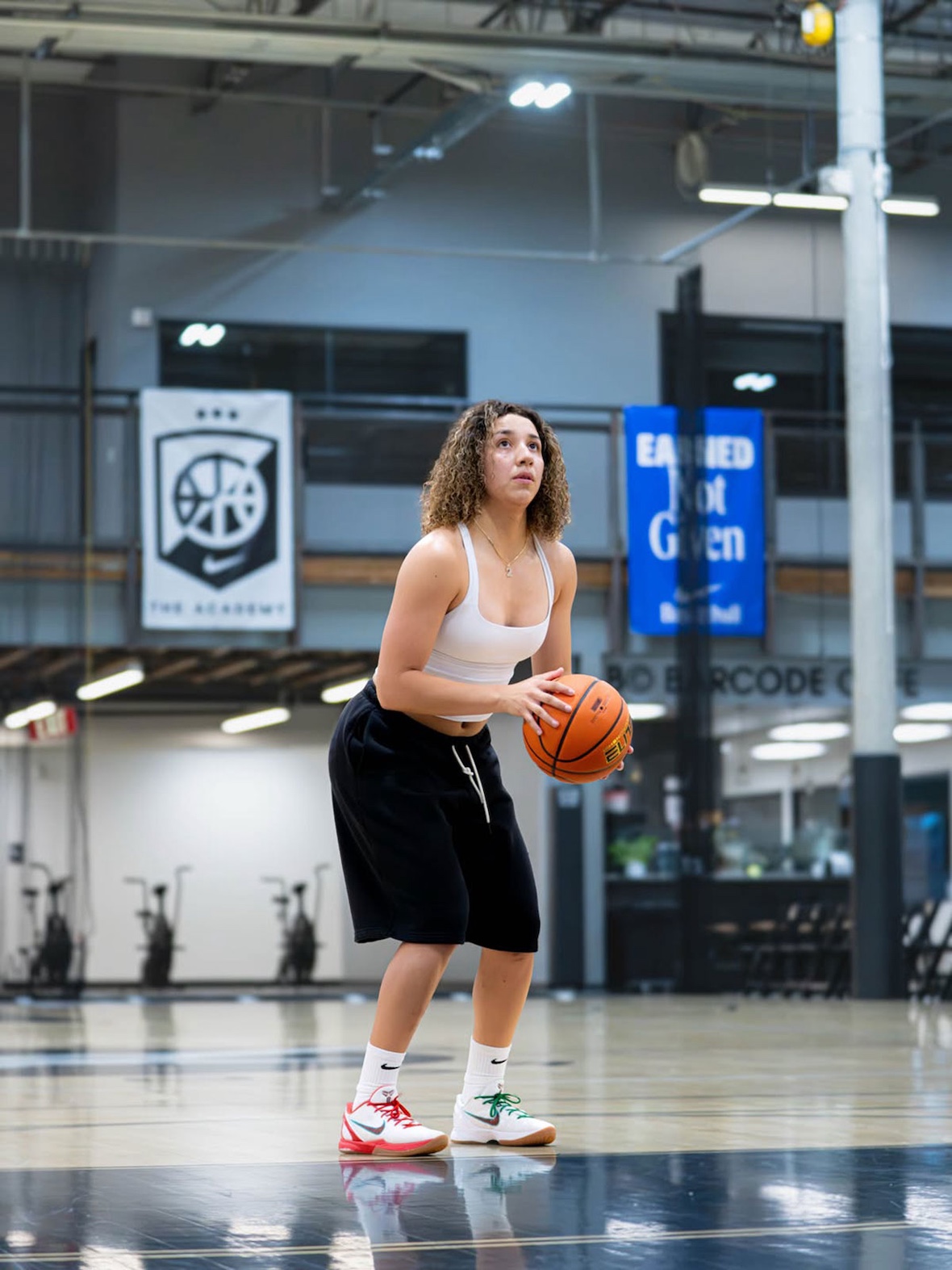 Aaliyah Chavez wearing exclusive Nike Kobe 6 Protro Mexico PE with red, white, and green gradient colorway during preseason warm-ups - detail view 2