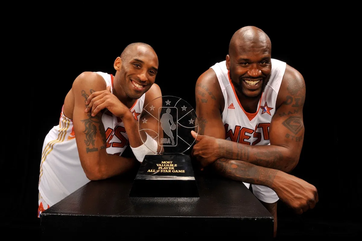 Kobe Bryant and Shaquille O’Neal smiling with the 2009 NBA All-Star Game MVP trophy after sharing Co-MVP honors.
