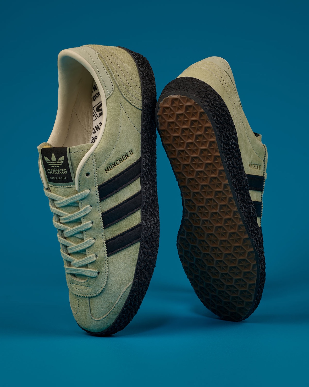 END. Clothing x adidas SPZL collection featuring brown Lytham, sage green Munchen II, and navy New York II Outdoor silhouettes with co-branded apparel - detail view 4