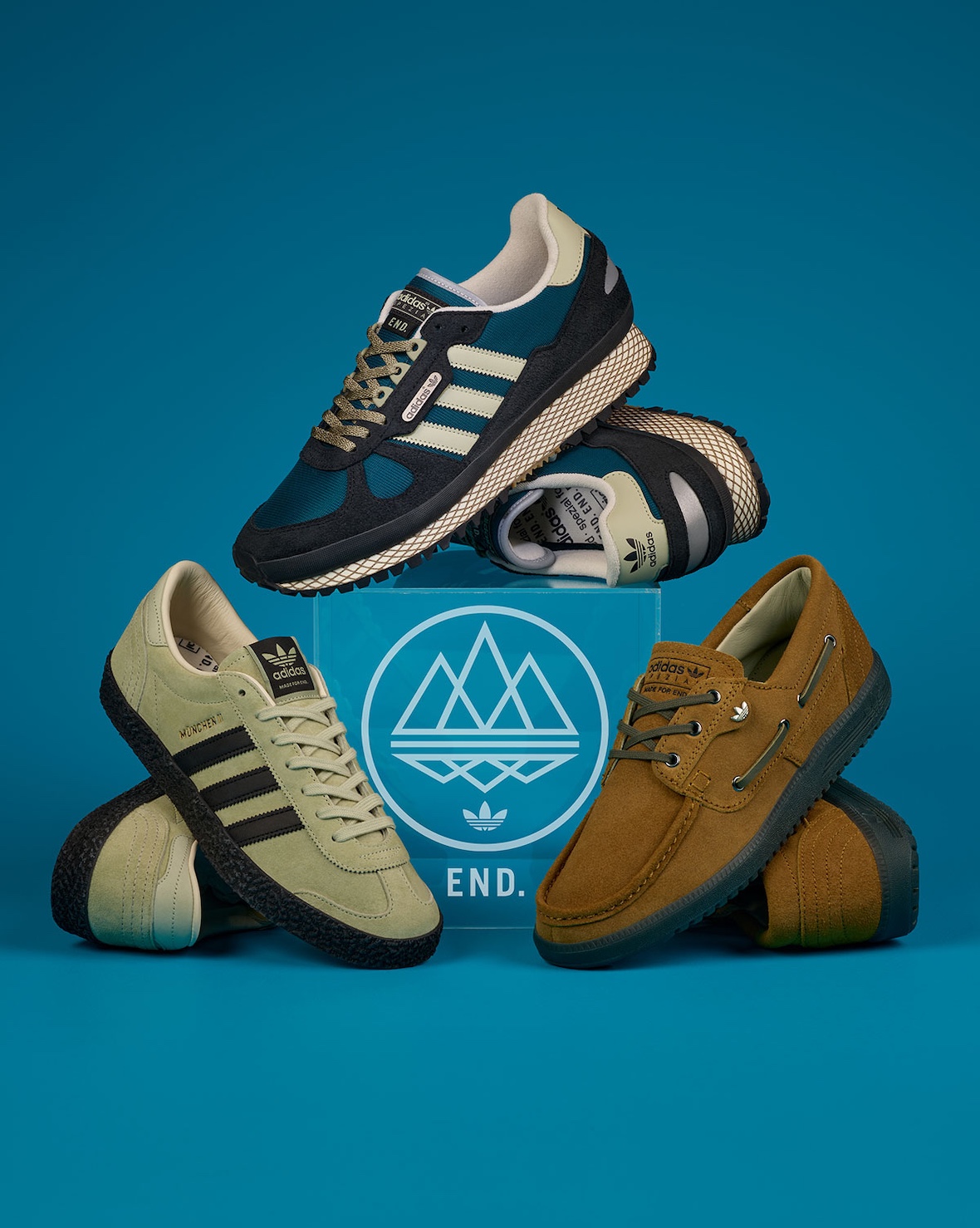 END. Clothing x adidas SPZL collection featuring brown Lytham, sage green Munchen II, and navy New York II Outdoor silhouettes with co-branded apparel - detail view 2