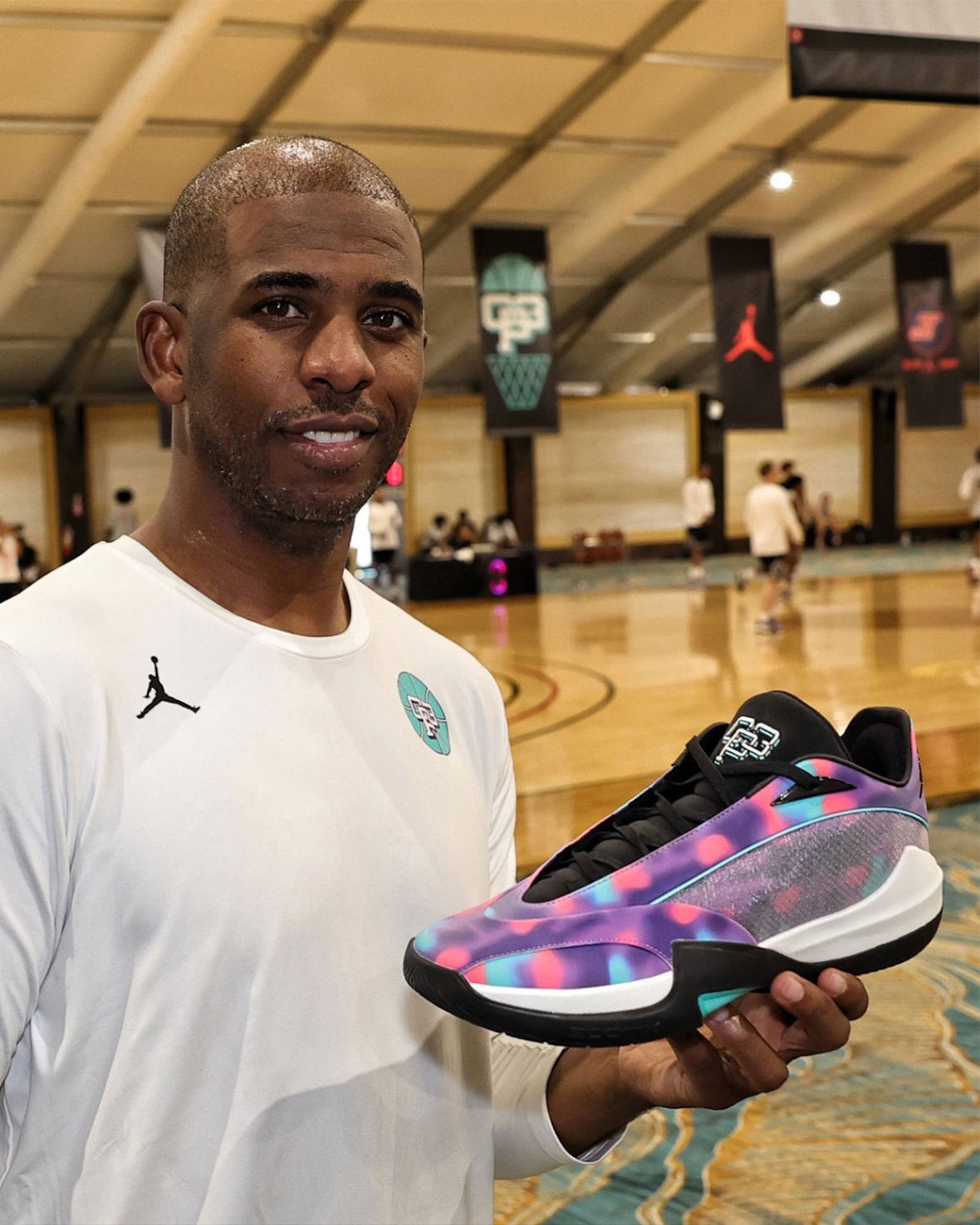 Jayson Tatum wearing the exclusive Jordan Tatum 4 PE in pink, purple, and yellow at the Tatum x CP3 Elite Camp in Las Vegas - detail view 5
