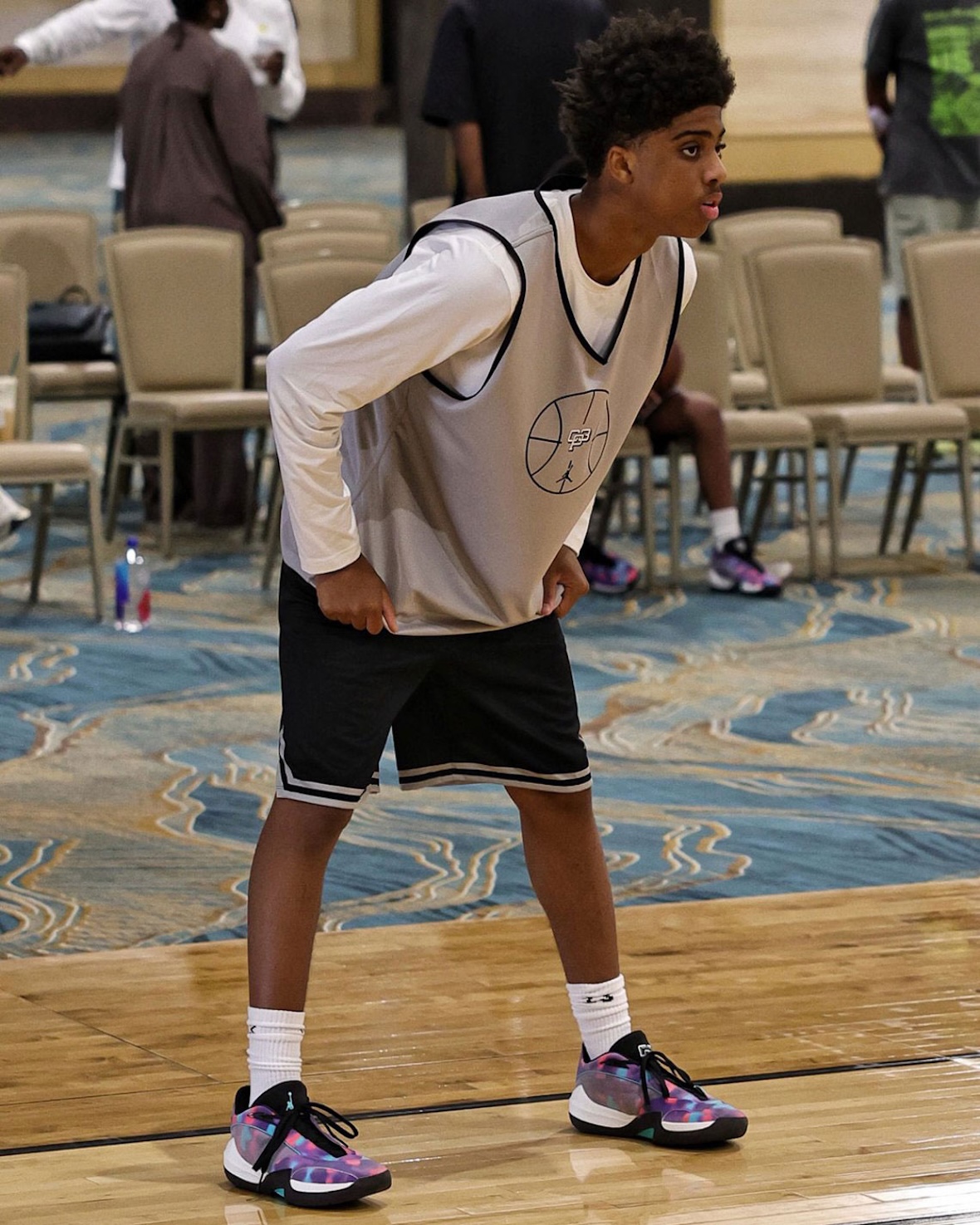 Jayson Tatum wearing the exclusive Jordan Tatum 4 PE in pink, purple, and yellow at the Tatum x CP3 Elite Camp in Las Vegas - detail view 3