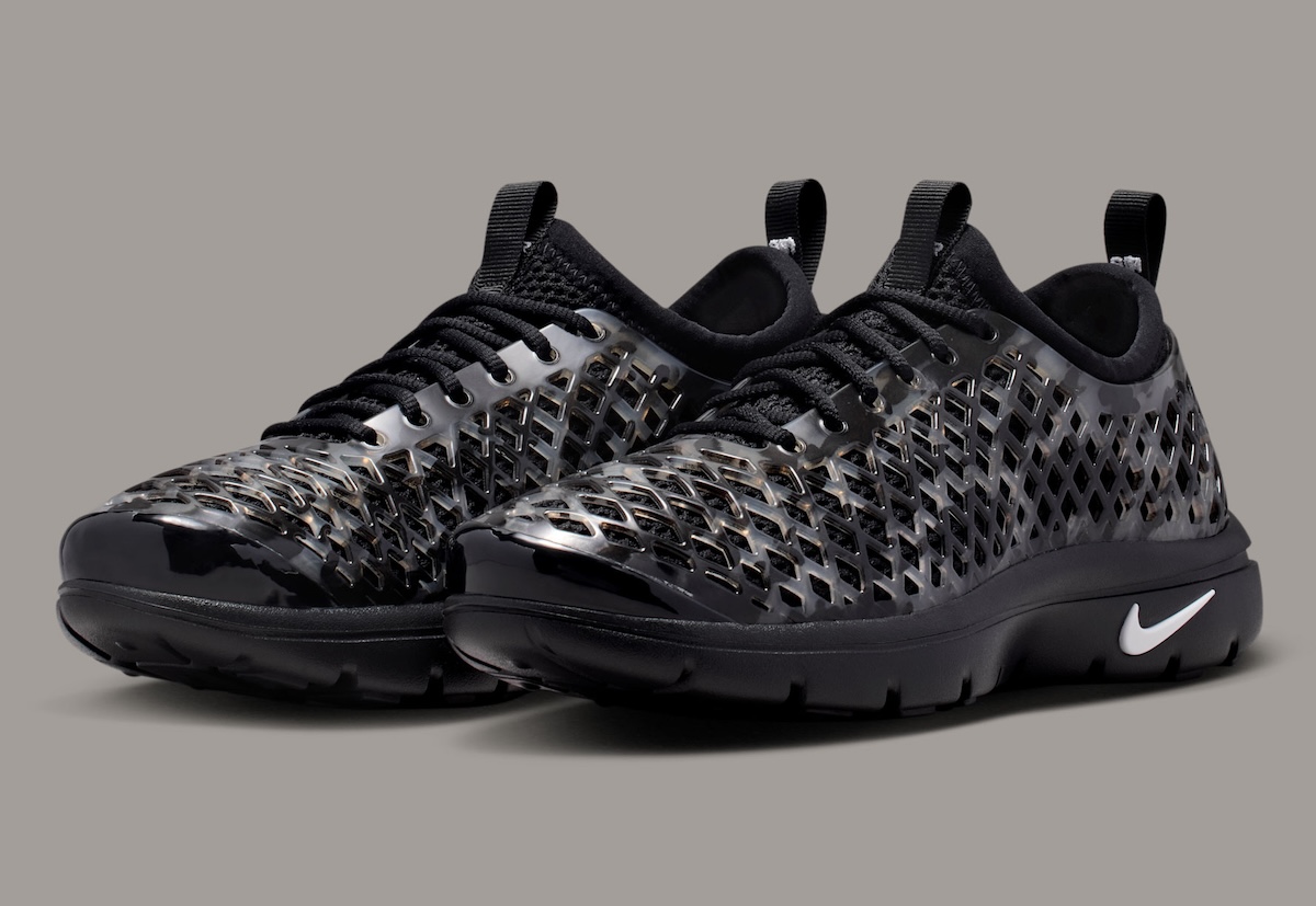 Nike Air Rejuven8 Black Camo slip-on recovery shoe with semi-translucent molded cage and white Swoosh - detail view 2