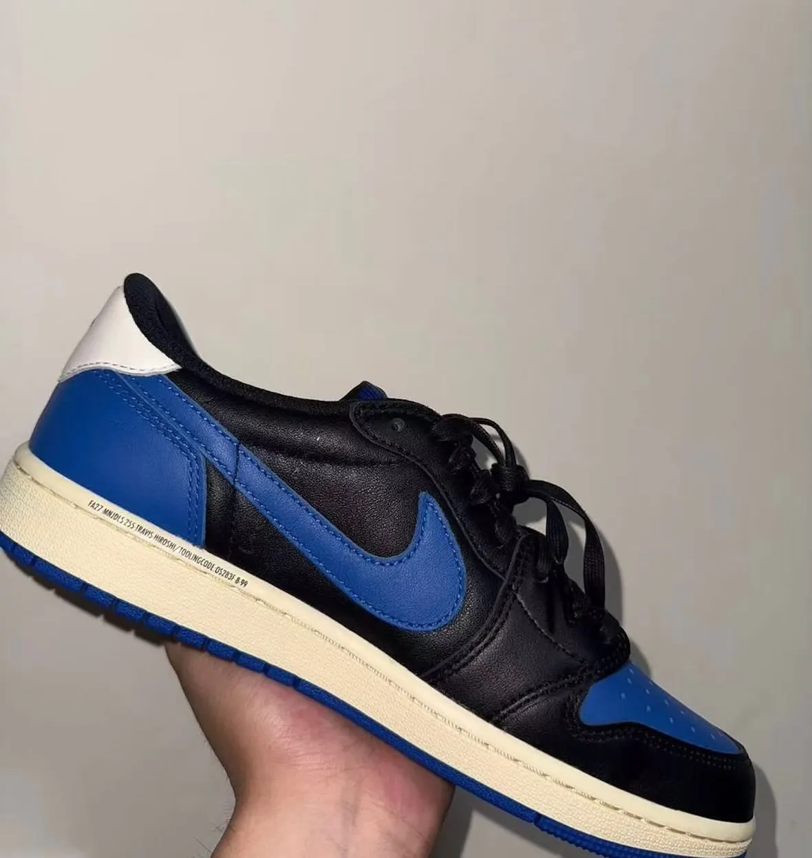 Travis Scott x Fragment x Air Jordan 1 Low sample in black leather with royal blue accents on toe box and Swoosh - detail view 4