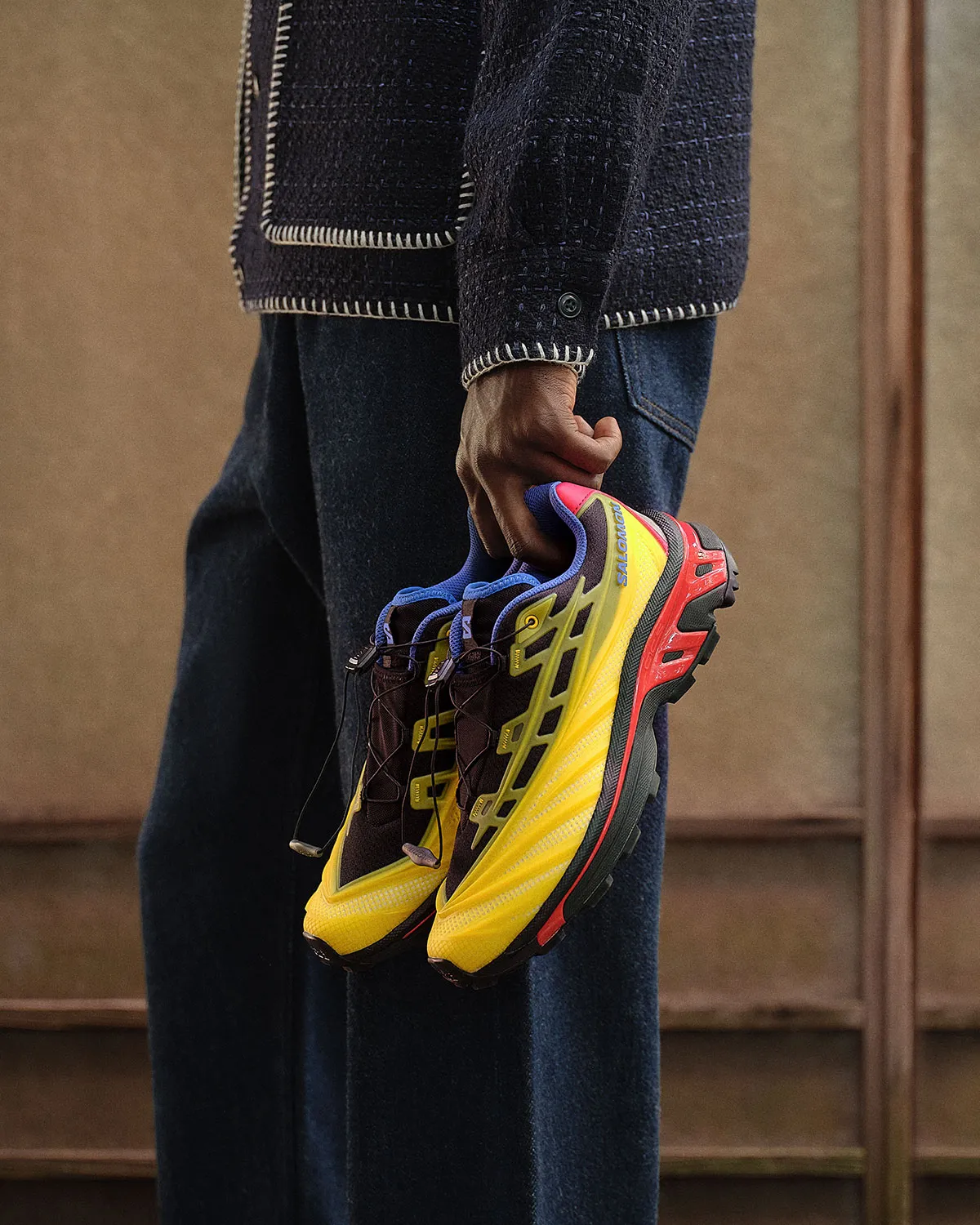 Kith x Salomon XT-EVO in black, yellow, red and blue colorway, featuring molded TPE upper and reinforced trail-running sole - detail view 3