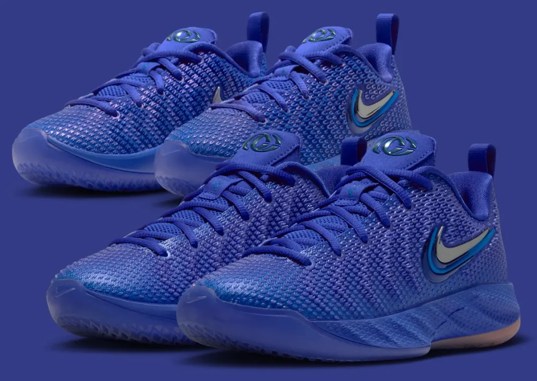 Nike Caitlin 1 "Racer Blue" in kids sizing, featuring deep royal blue upper with chrome Swoosh and embroidered "22" detail - detail view 1