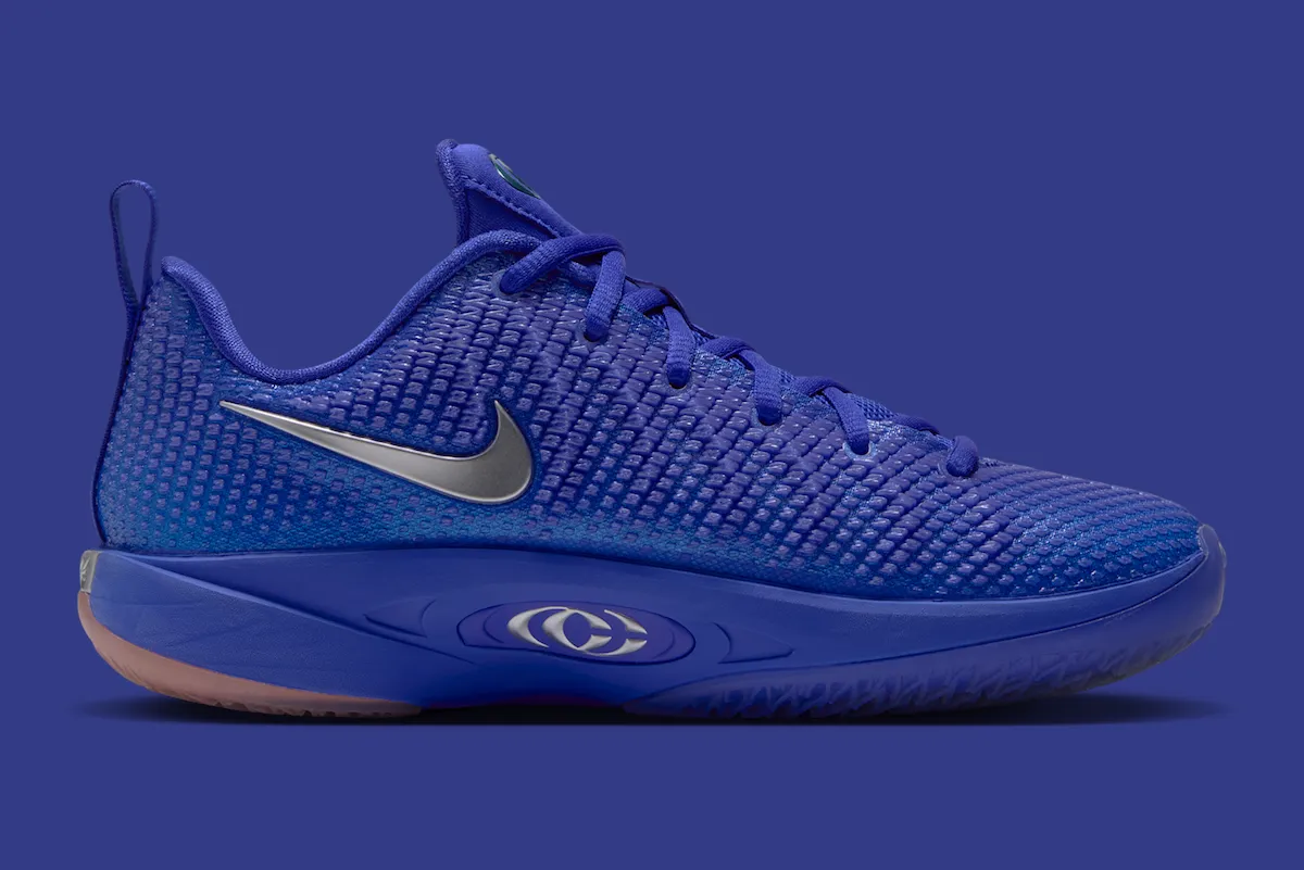 Nike Caitlin 1 "Racer Blue" in kids sizing, featuring deep royal blue upper with chrome Swoosh and embroidered "22" detail - detail view 5