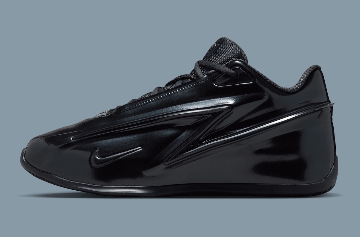 Nike KD 19 "Candy Paint Black" featuring all-black upper with glossy molded shell panels and Stadium Green insole branding - detail view 3
