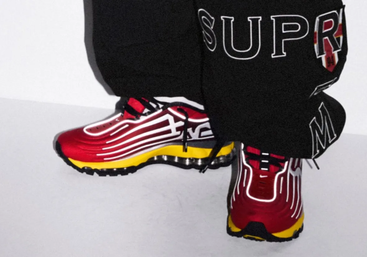 Supreme x Nike Air Max 2000 in University Red and Speed Yellow, showing the Supreme lettering branding on the lateral side - detail view 2